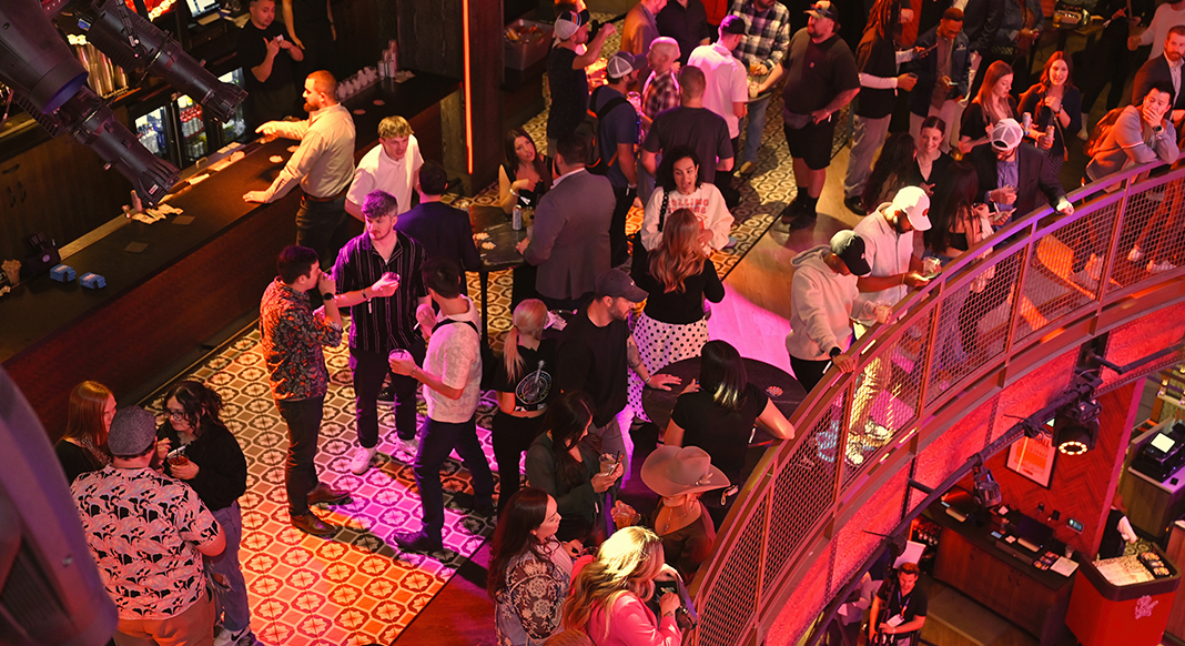 2025 Young Pro Party groups of people around the bar