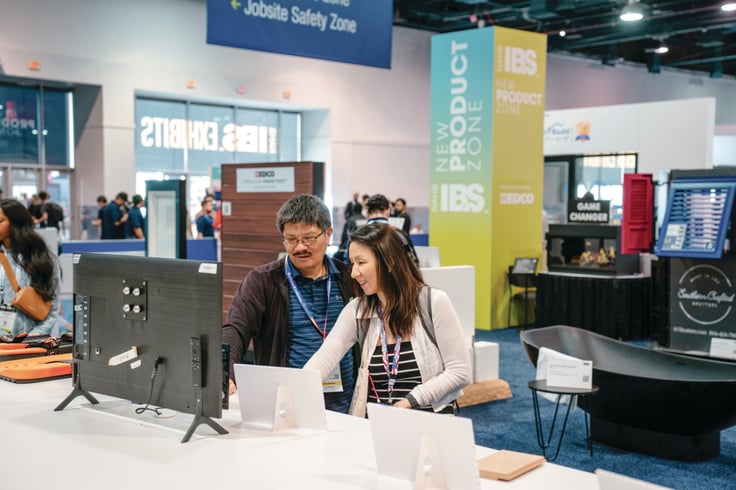 Building professionals discuss products on the IBS exhibit floor