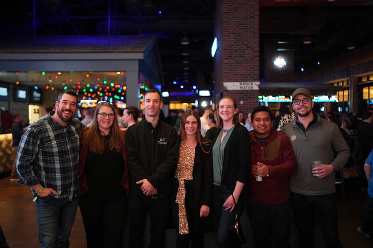 Group of men and women smiling